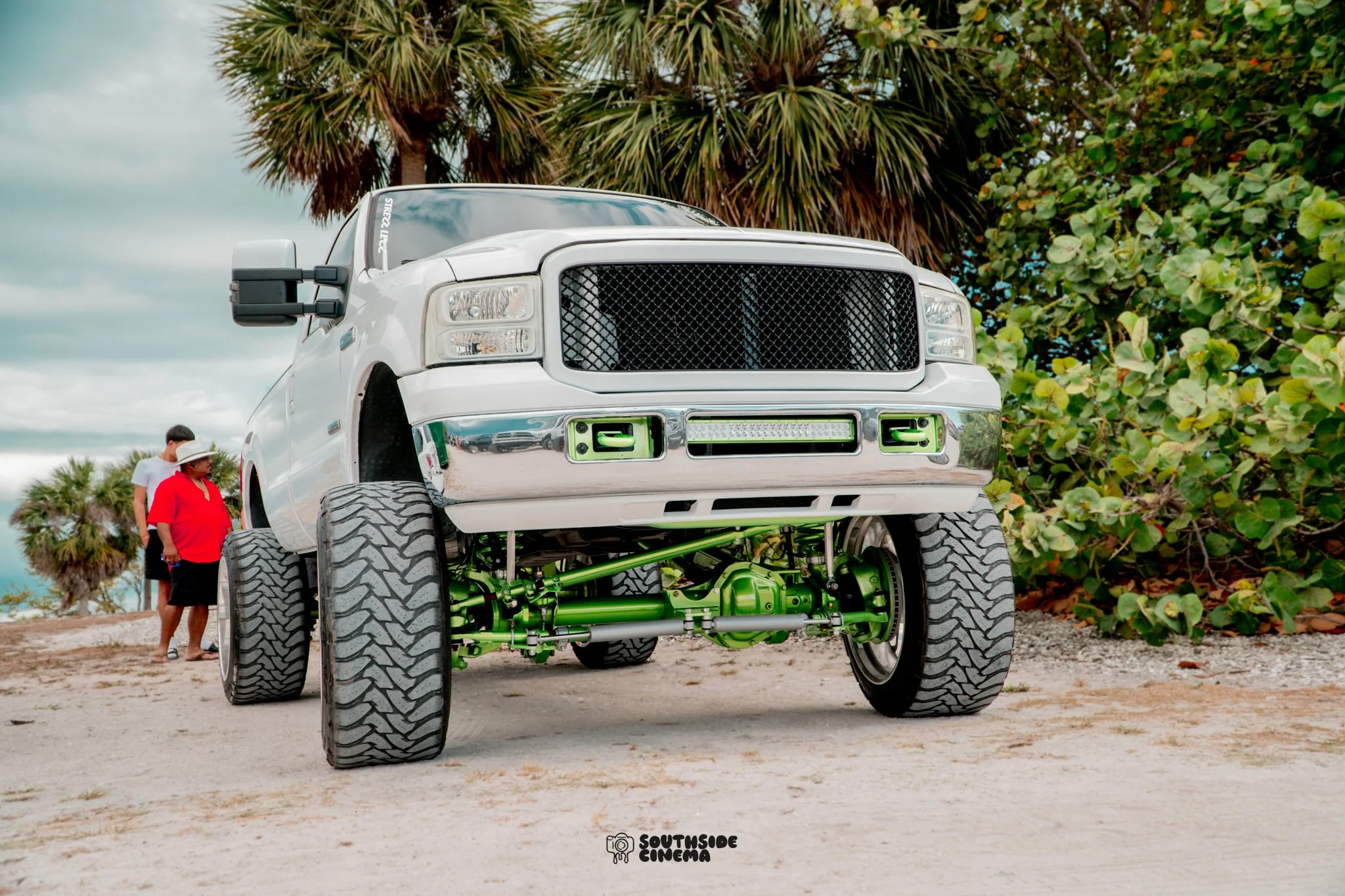 White lifted Ford Powerstroke diesel truck photographed in Florida for automotive social media marketing and digital content creation.