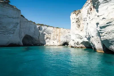 Cliffs and turquoise water in a coastal landscape