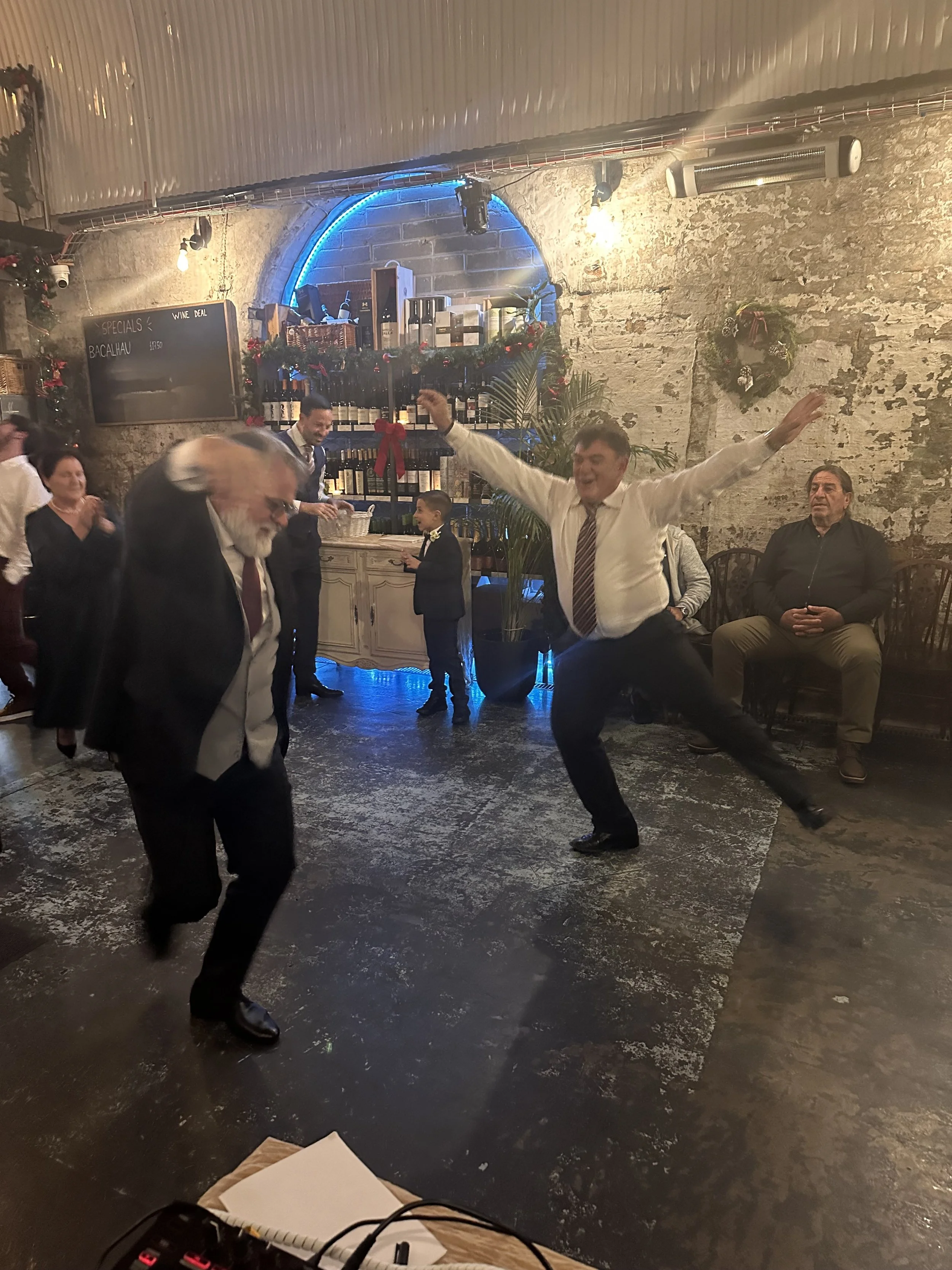 Guests dancing at a Greek wedding in London with Lucky Evi DJing
