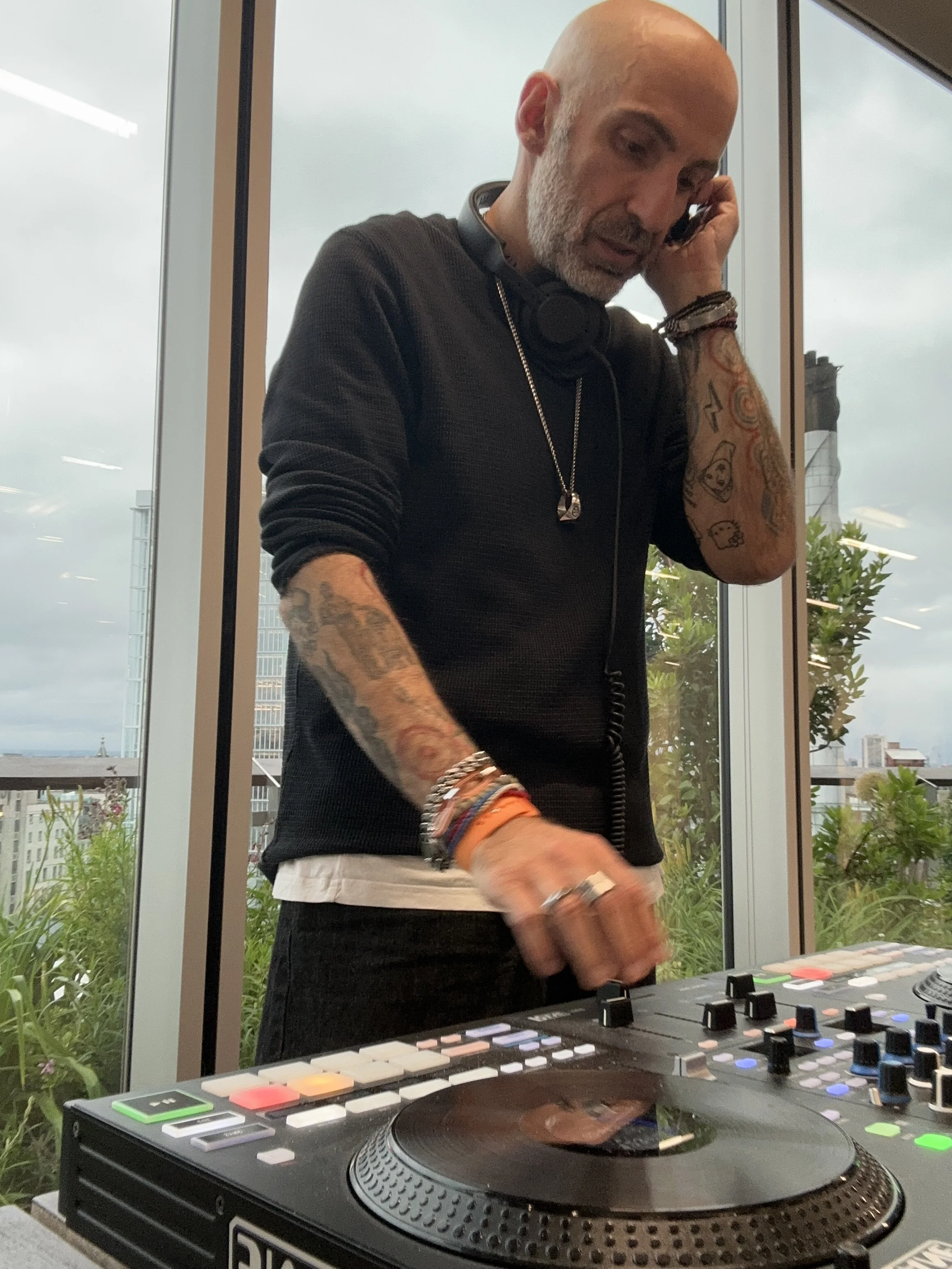 Lucky Evi, London DJ and producer, on the phone by a window