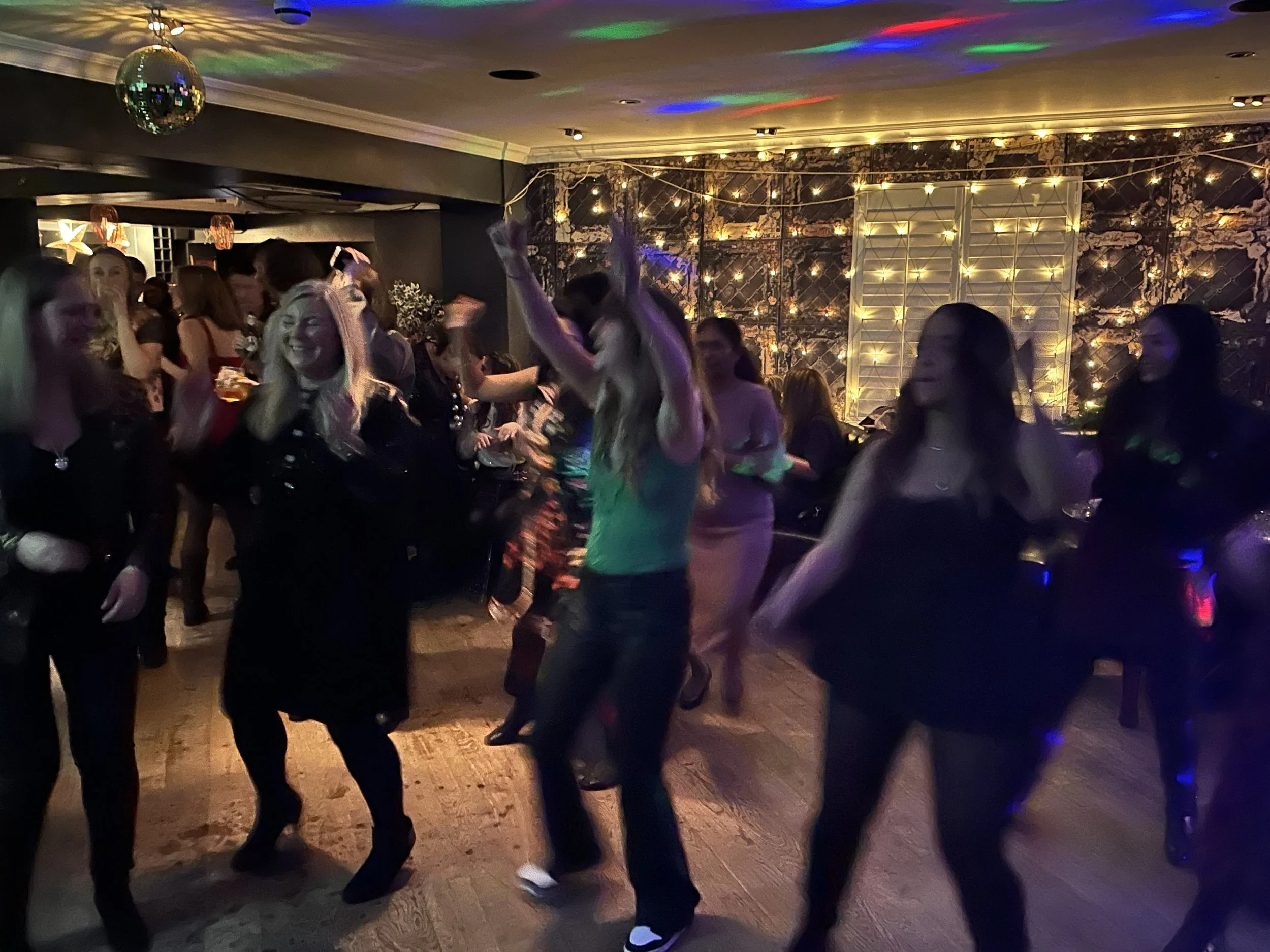 Guests dancing at a private event with Lucky Evi DJing, London