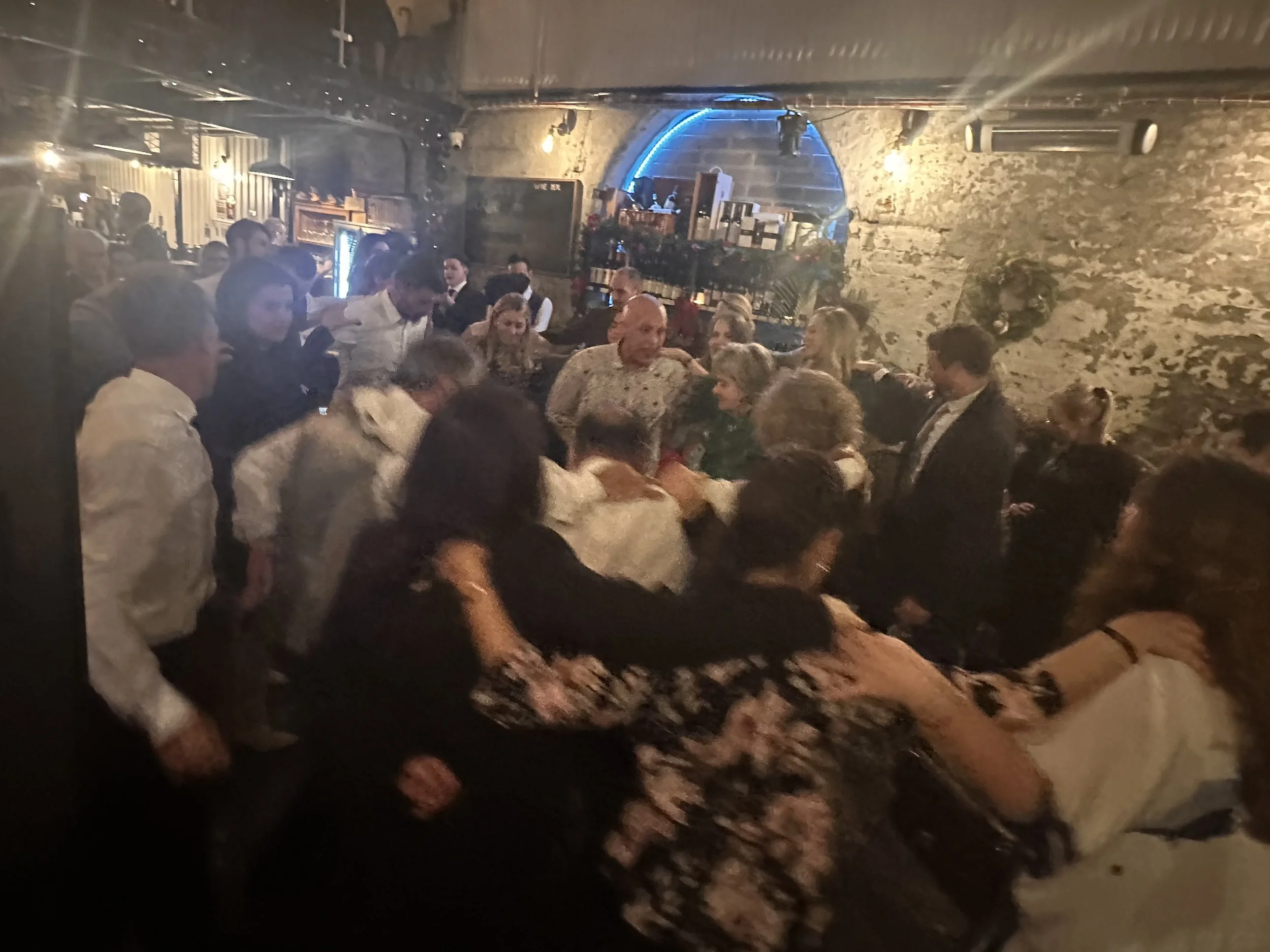 Guests dancing at a wedding venue with Lucky Evi DJing, London