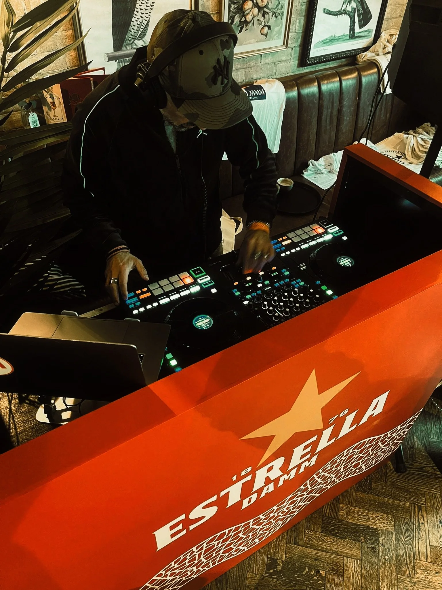 Lucky Evi DJing at an Estrella corporate event in London