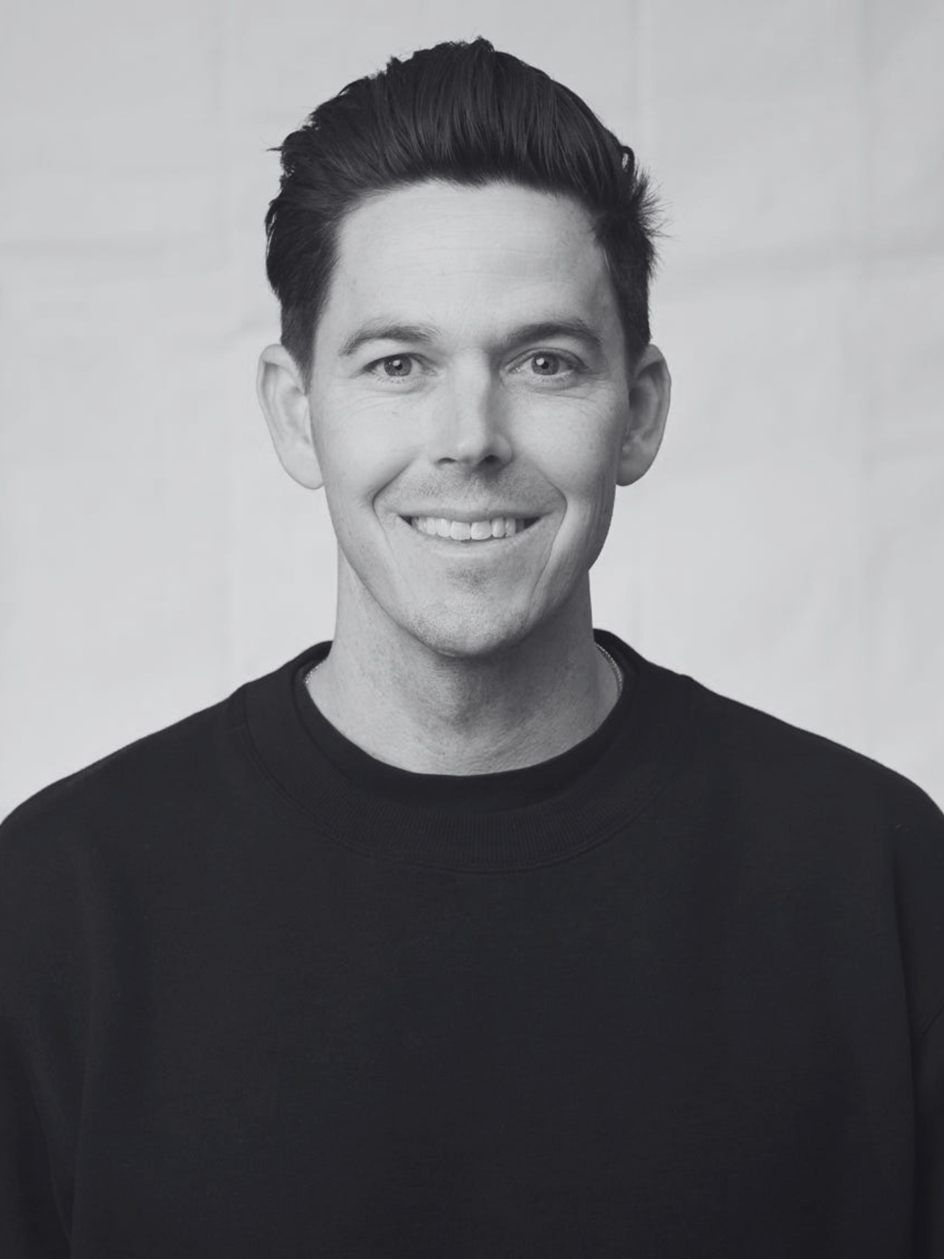 Black and white portrait of Darren Rouanzoin