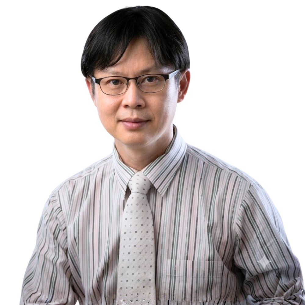 A man with glasses, wearing a striped dress shirt and a patterned tie, looking at the camera.