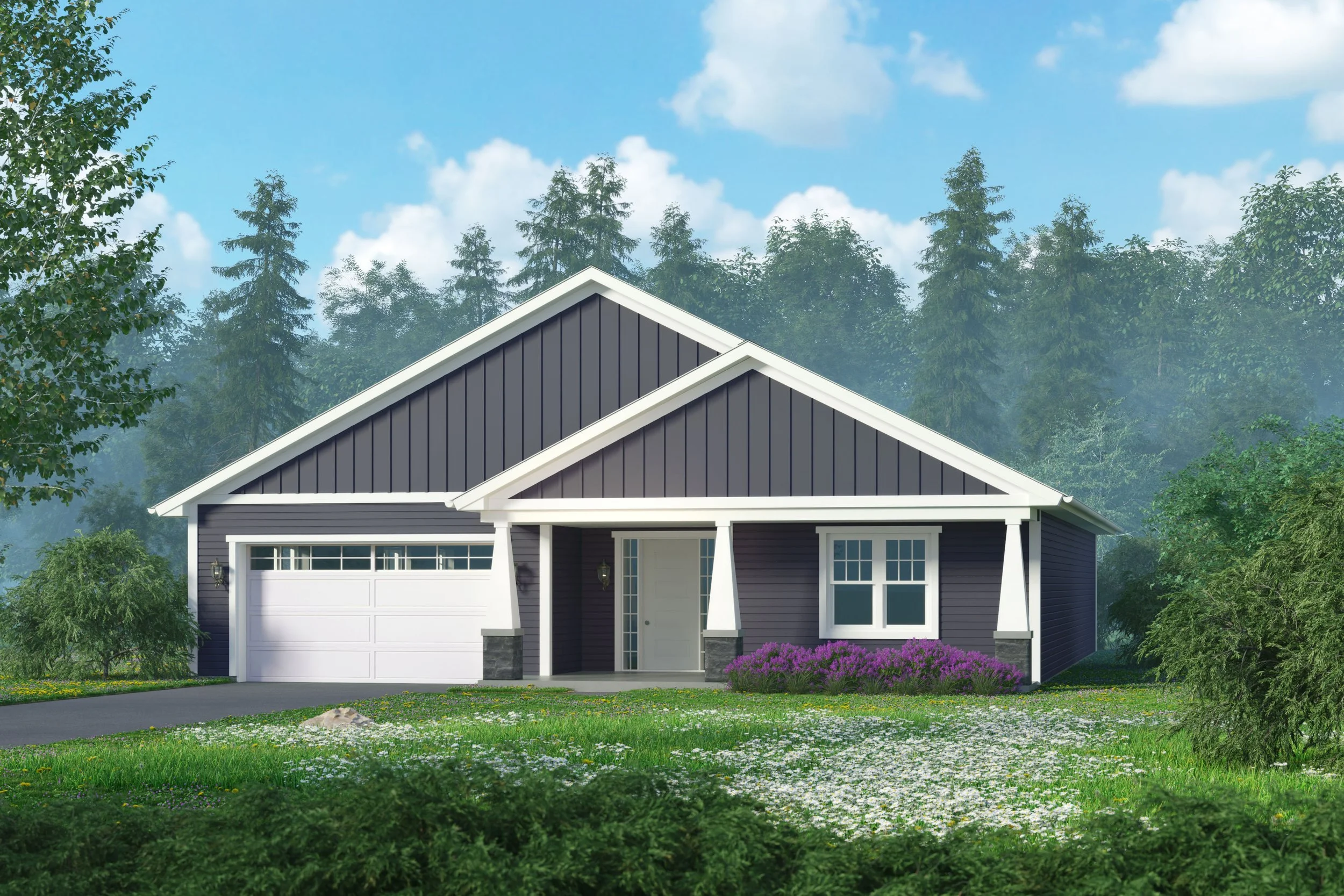 A house with dark gray siding, white trim, a front porch, surrounded by a grassy lawn with purple flowers, and tall trees in the background under a partly cloudy sky.