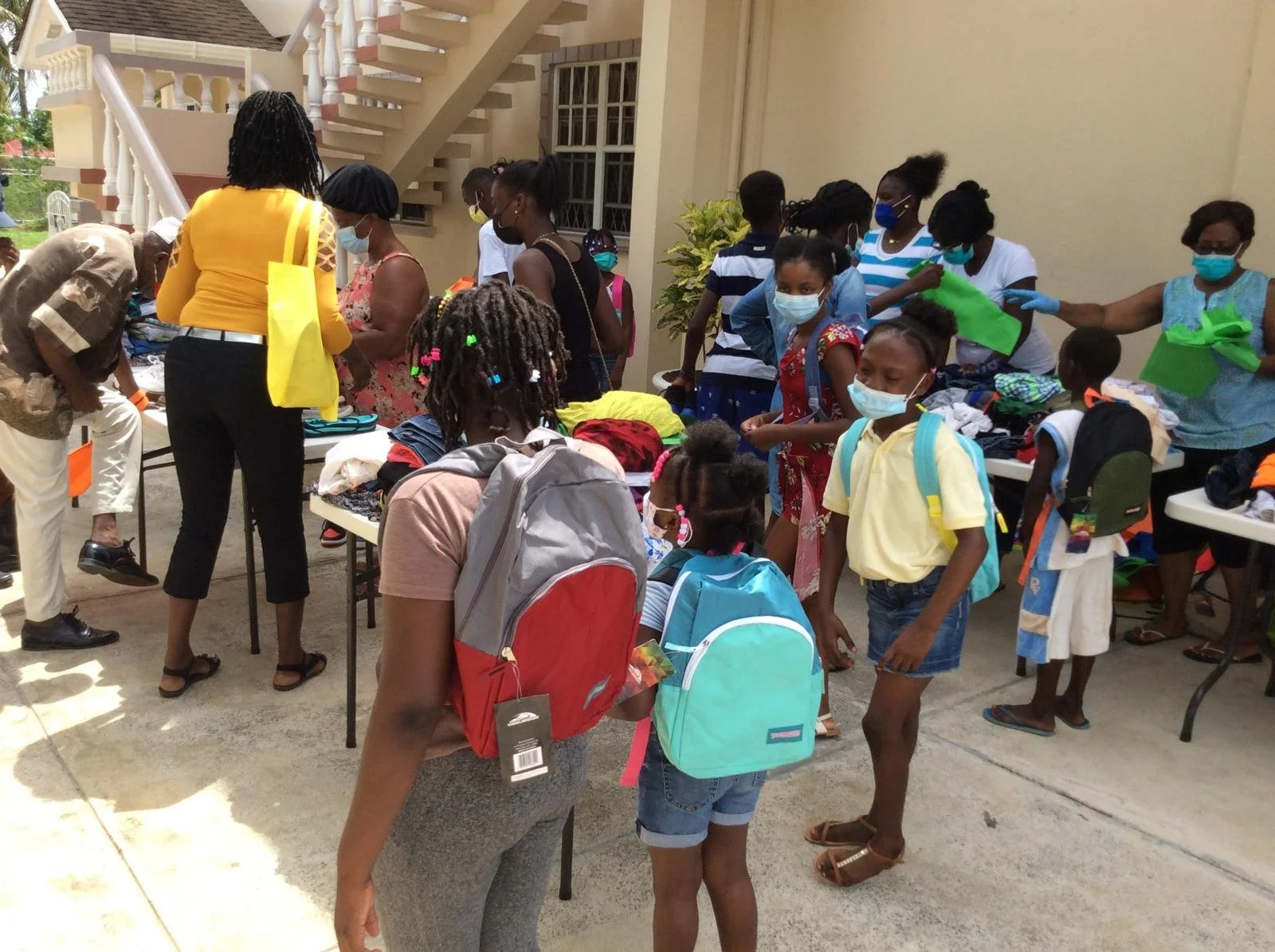 Community in action—providing school supplies and essential resources with care.