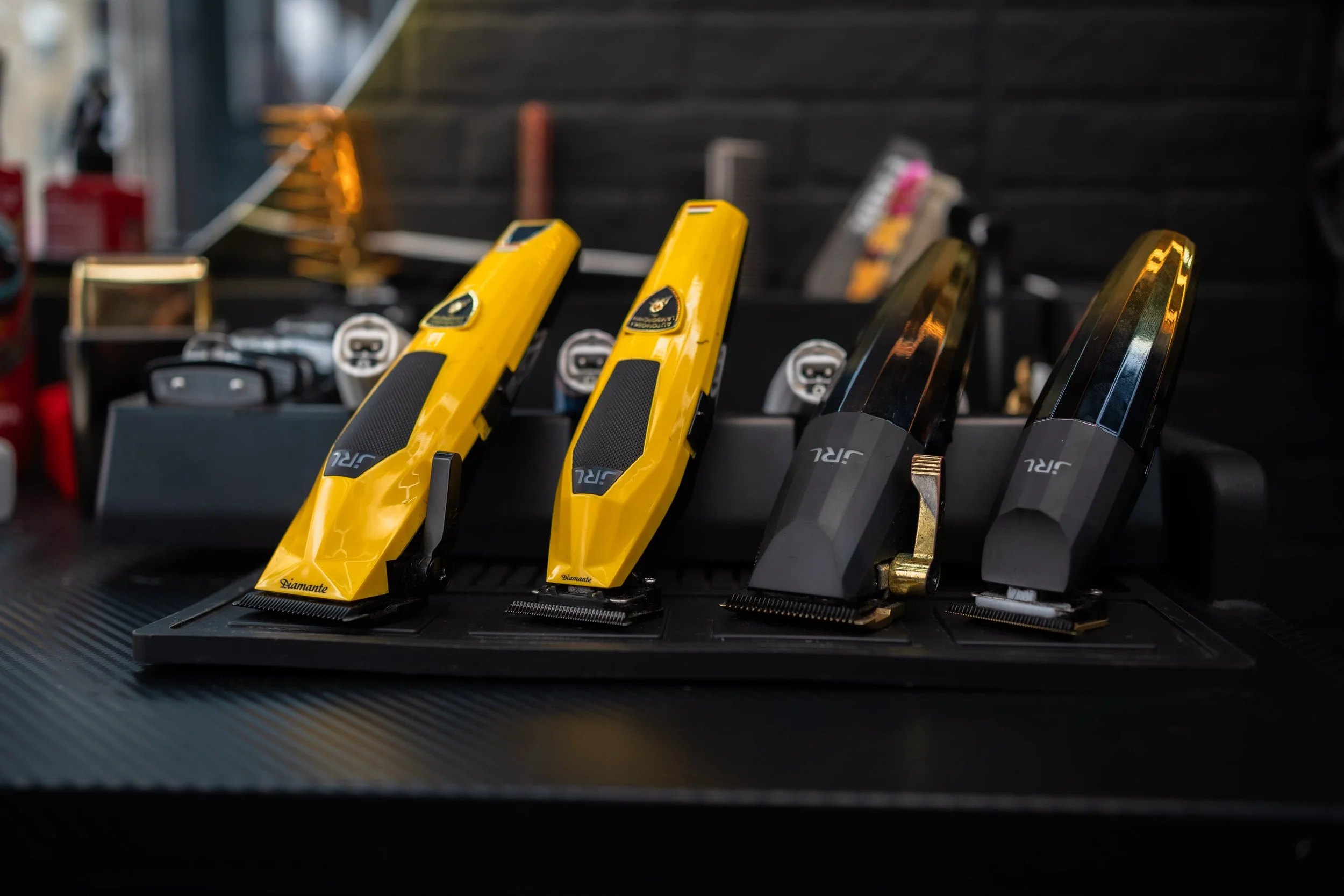 Close-up of yellow electric hair clippers on display in a store.