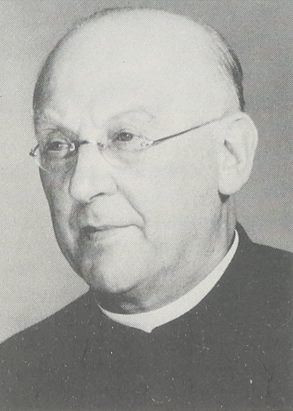 Ein schwarz-weißes Portrait eines älteren Mannes, der schütteres Haar hat und eine Brille trägt.