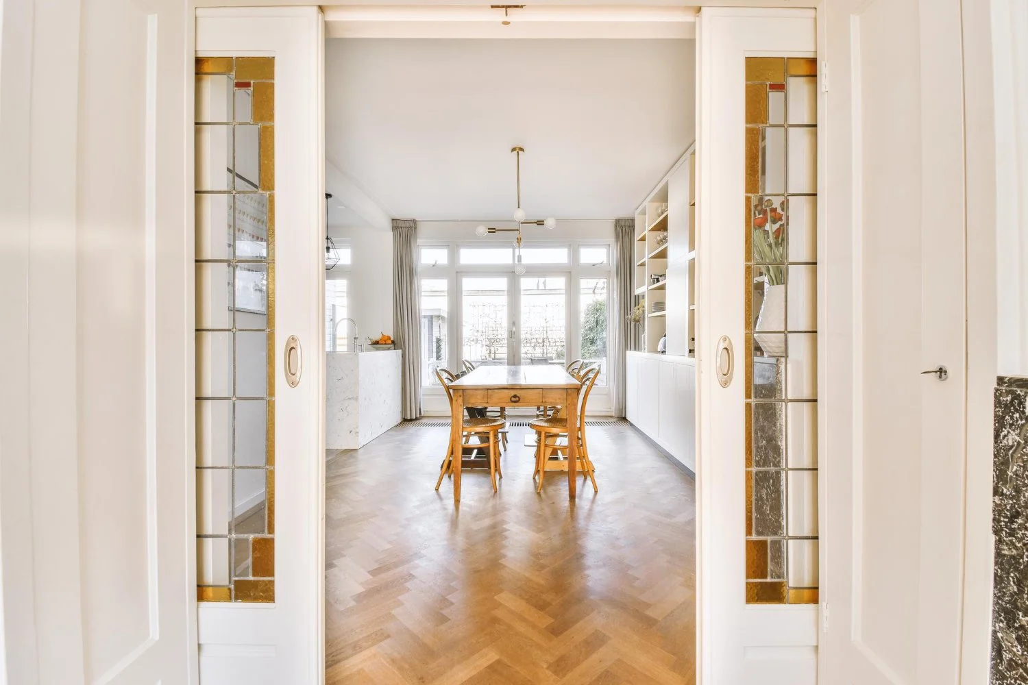 Glass interior doors that allow light flow between rooms in Dallas homes