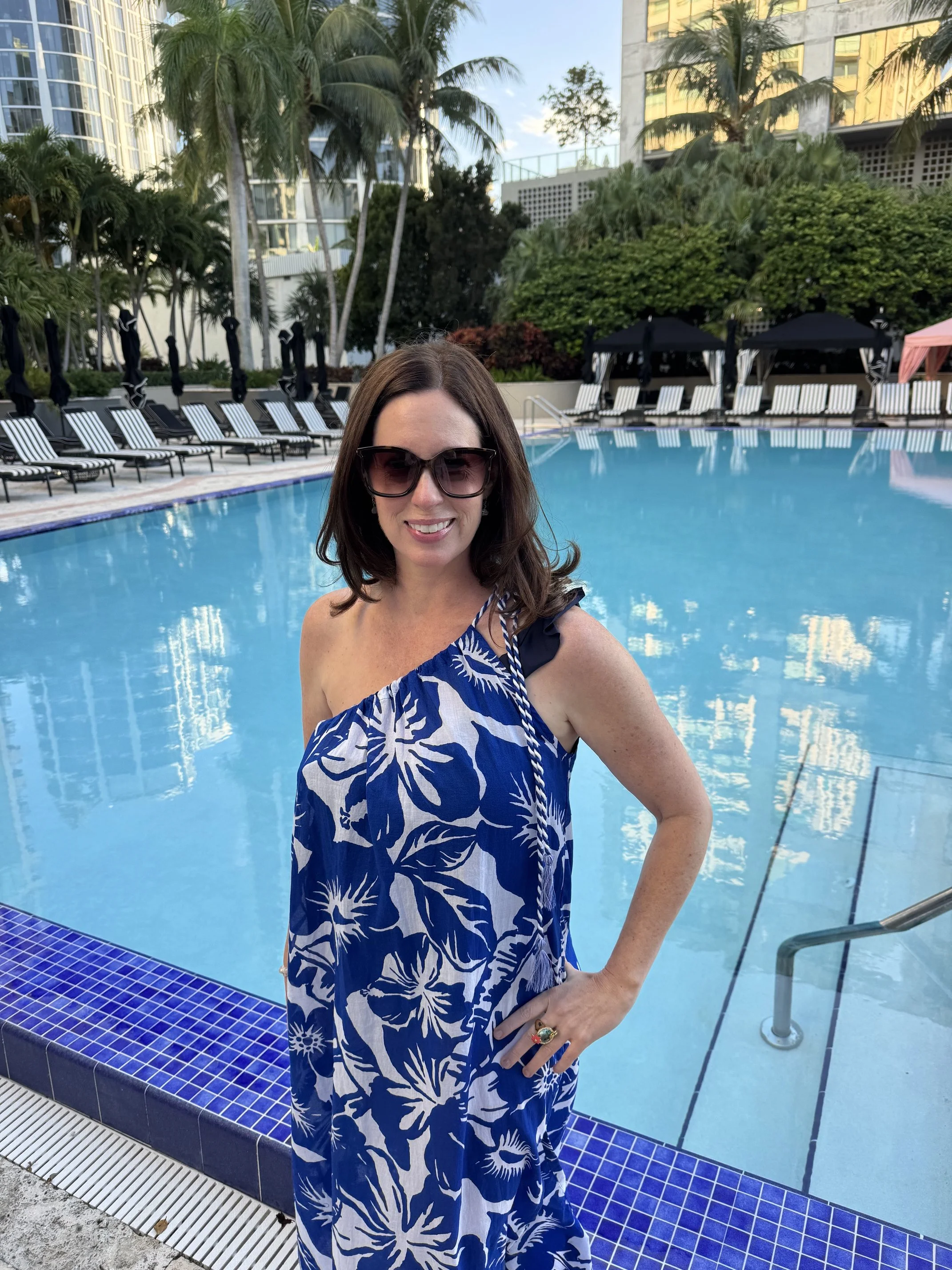 Founder of Shay Palms poolside at a tropical resort