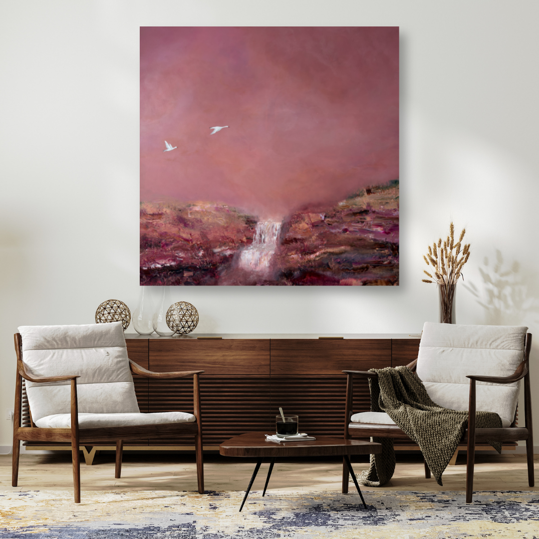 Abstract painting of a pink and purple landscape with a waterfall and two white birds in the sky, hung above a wooden sideboard in a modern living room.