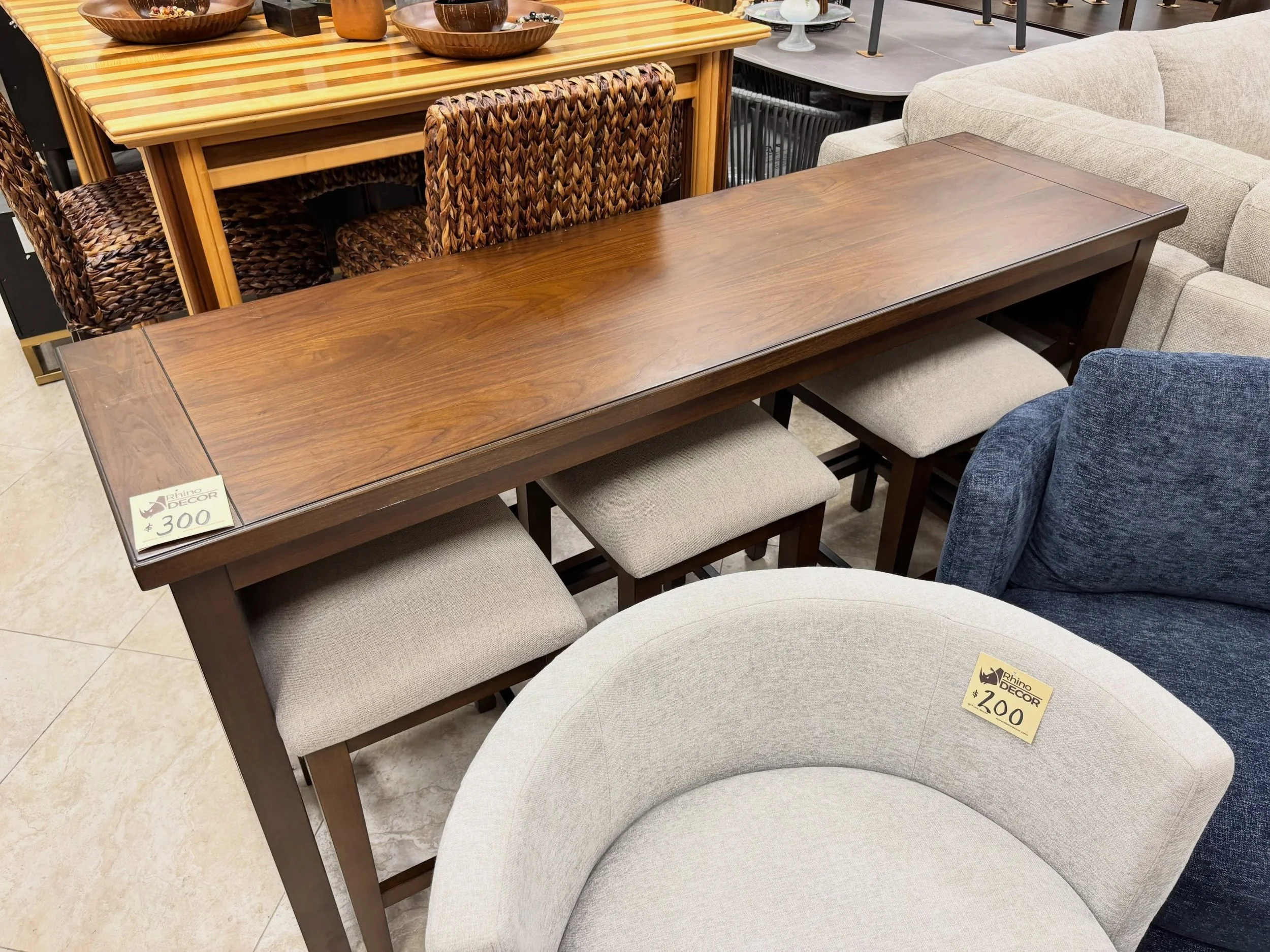 LOWERED PRICE &mdash; Clean and Current.

Wooden Counter Height Table &amp; 3 Stools
✅ Like New Condition
📏 Table: 68&rdquo; x 20&rdquo; x 34&rdquo;H, Stools: 18&rdquo; x 15&rdquo; x 23&rdquo;H
💲 300

Available now at Rhino Decor
📍 13393 W Colonia