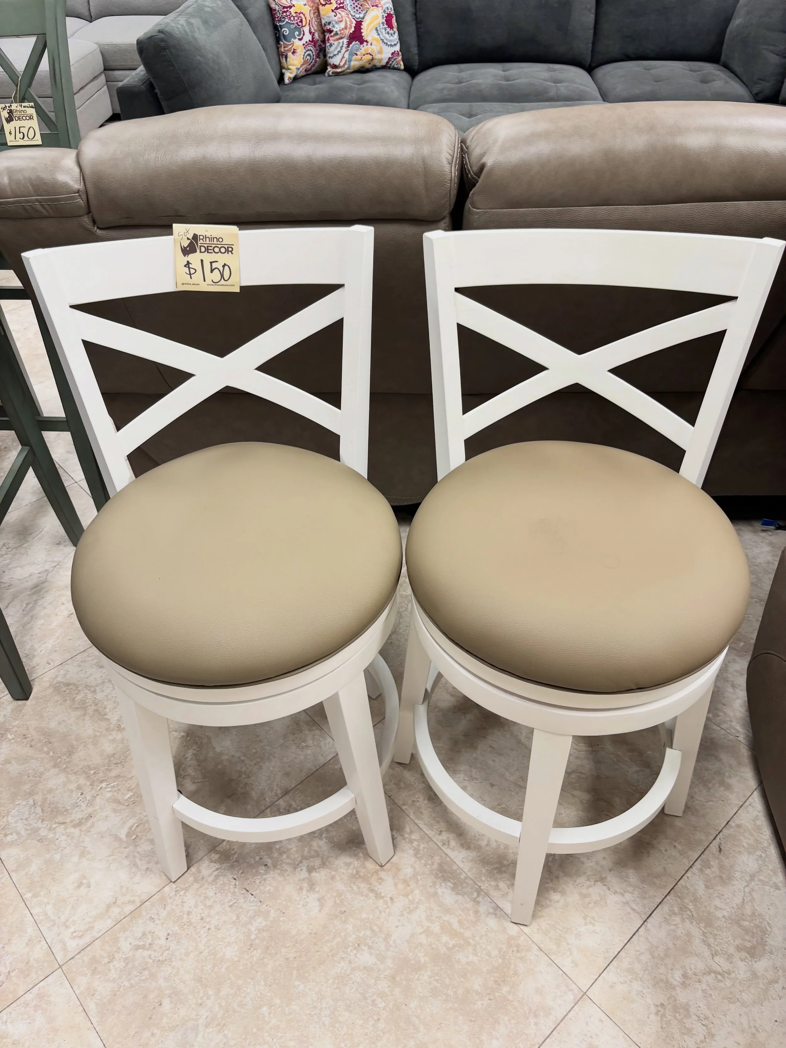 JUST ARRIVED &mdash; and priced to move.

Grace White &amp; Tan Counter Stools (2)
✅ Great Condition 
📏 21&rdquo; x 21&rdquo; x 38&rdquo;H, Floor to Seat 26&rdquo;H
💲 150 for pair 

Available now at Rhino Decor
📍 13393 W Colonial Dr, Winter Garden