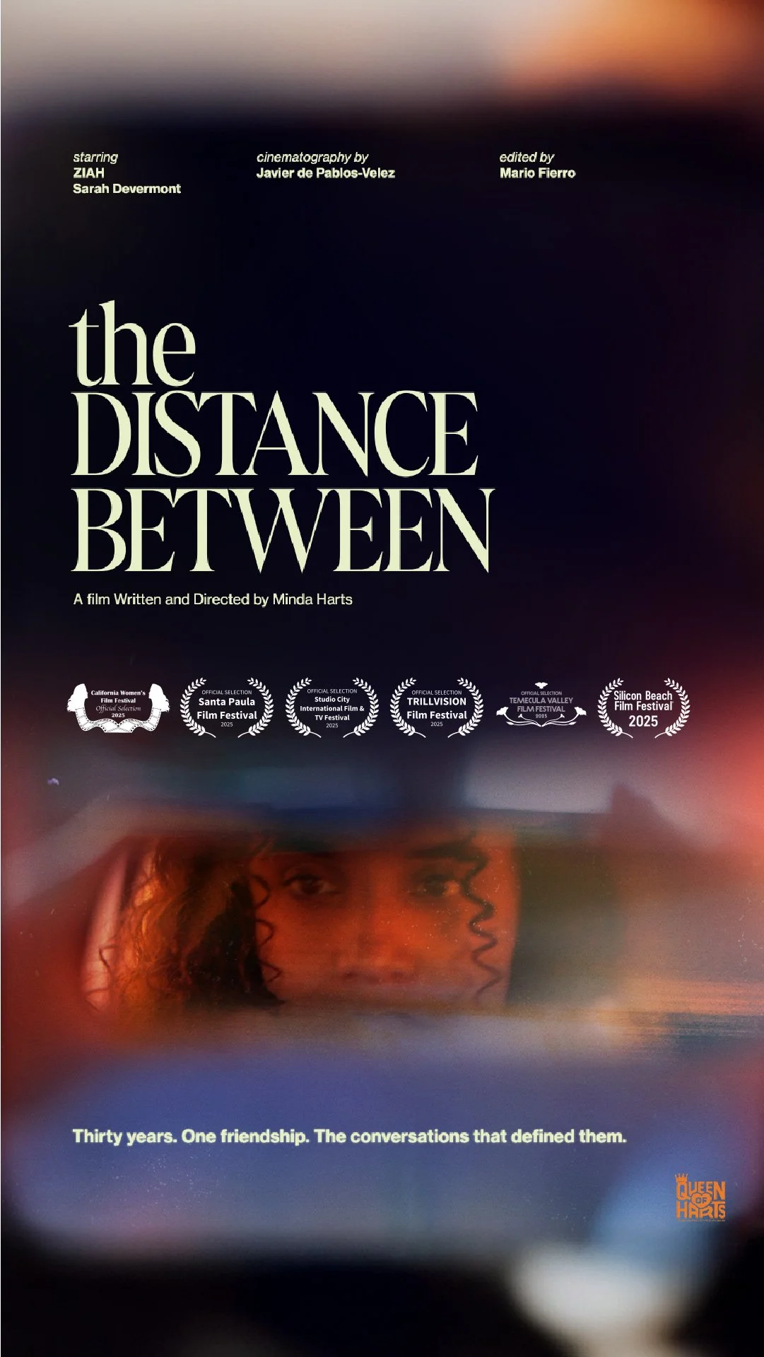 Poster for the film "The Distance Between" featuring a close-up of a woman's face with curly hair, and various film festival laurels at the bottom.