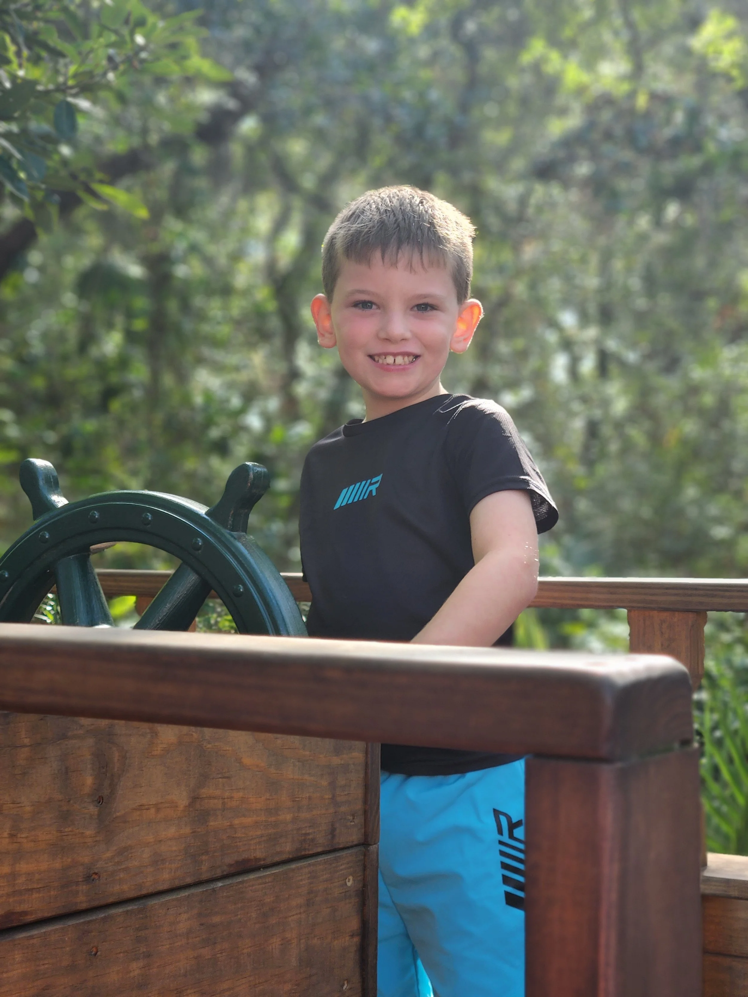 Photo of the baker’s son smiling outdoors