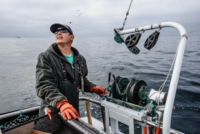 Toriumi checks his gear as he sets up to troll for salmon. Photo credit: David Hills 2018 (Fishy Pictures).