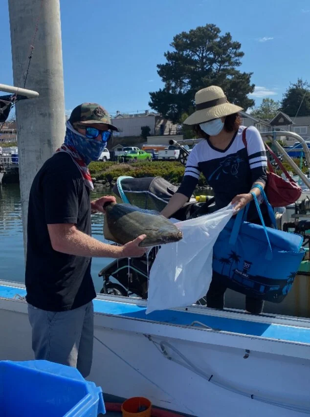 Buying halibut off the boat in Santa Cruz. Photo credit: Cody Reed, F/V Ruth Ann