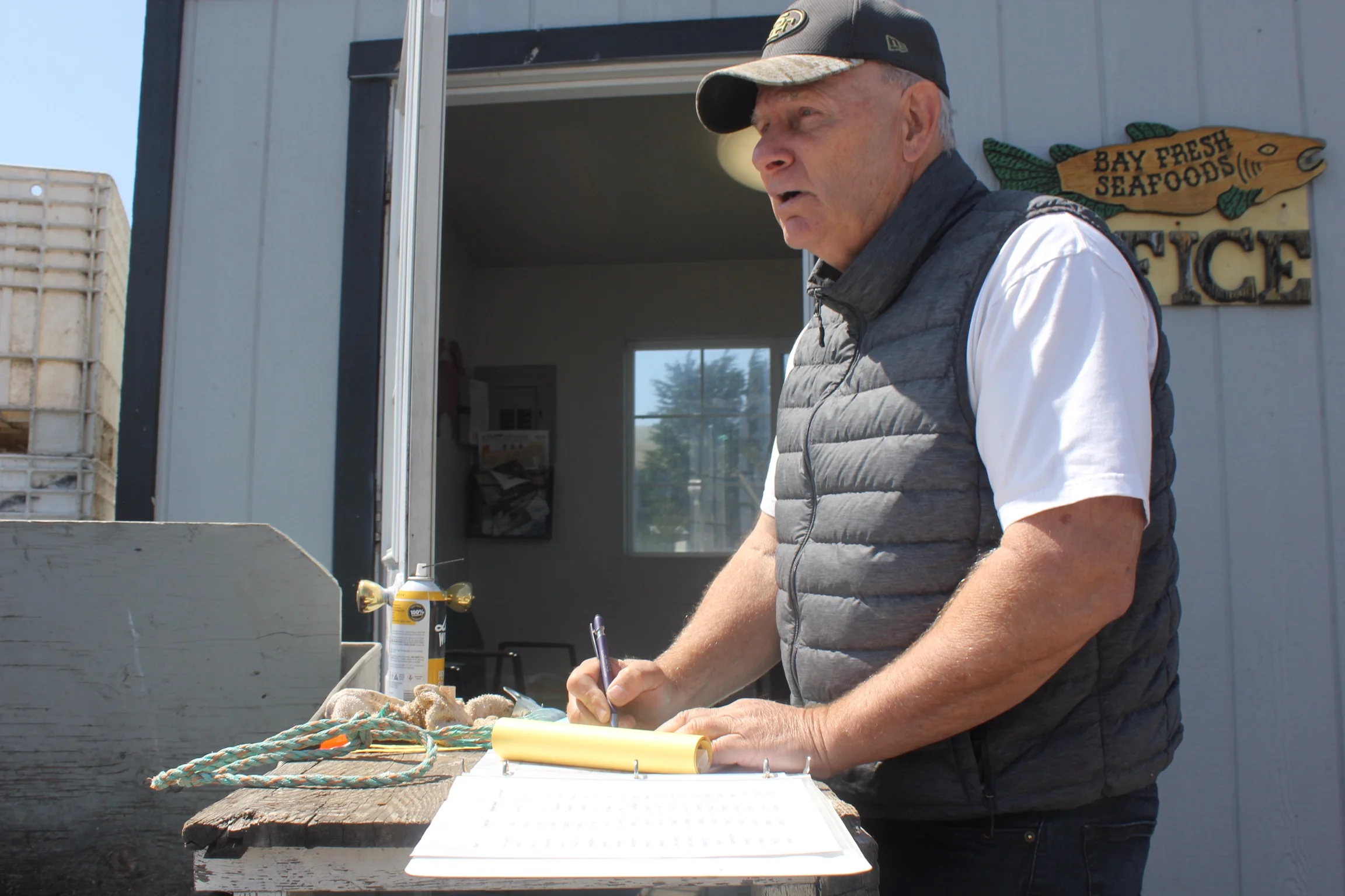 Roger Whitney landing catch at his Bay Fresh Seafood’s office. Photo credit: Ian Cole.
