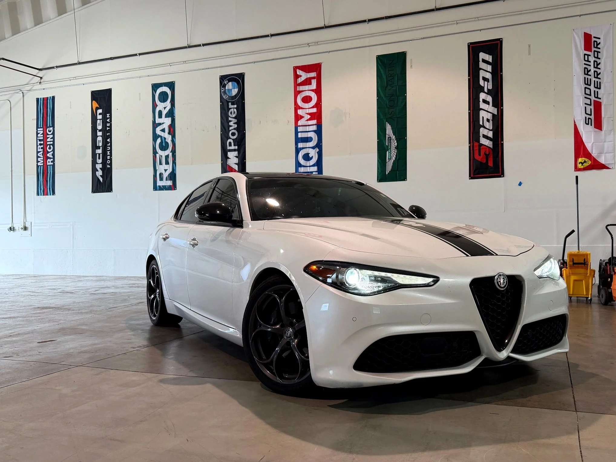 White Alfa Romeo Giulia inside the EuroSpring Autoworks shop in Castle Rock, CO