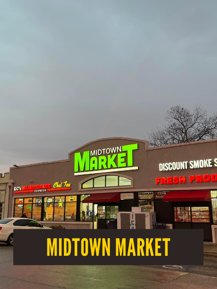 Exterior view of Midtown Market storefront with bright green sign, red awnings, and several stores including a burger place, a tea shop, and a fresh produce section, on a cloudy day.  Westport East.