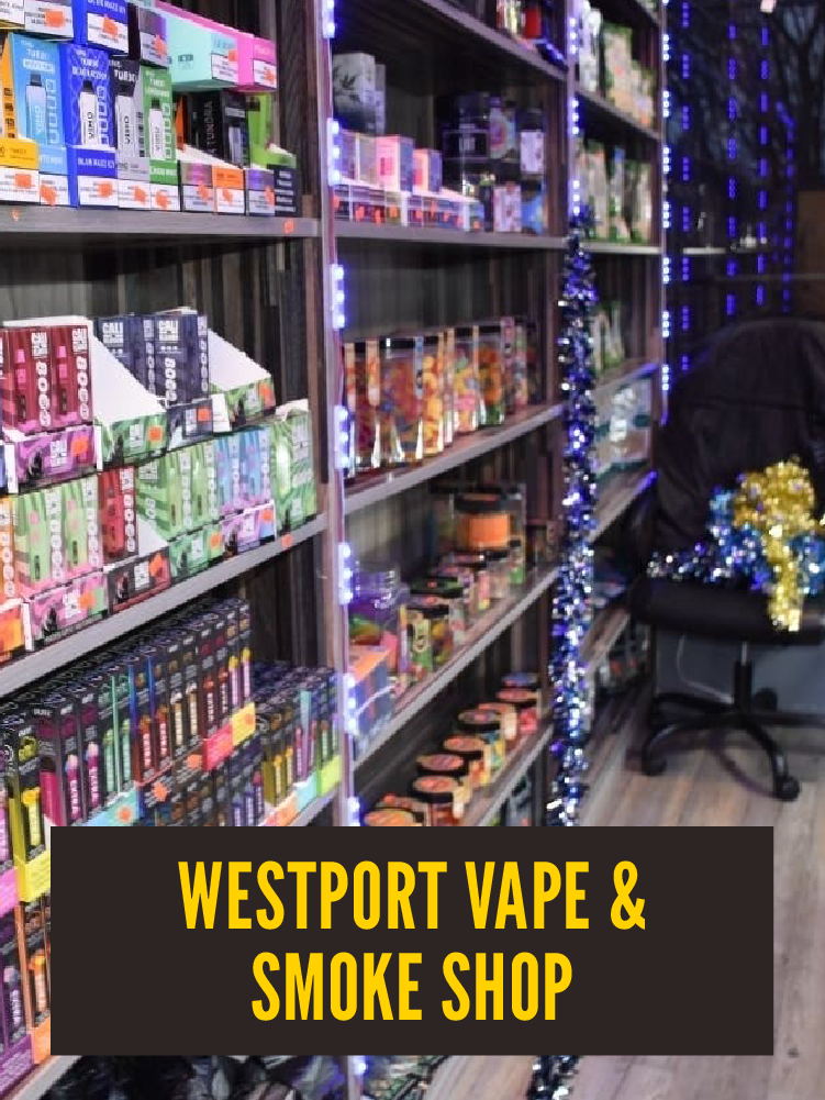 Shelves stocked with vape and smoke products, decorated with string lights and holiday decorations, in a shop named 'Westport Vape & Smoke Shop'.  Westport East.