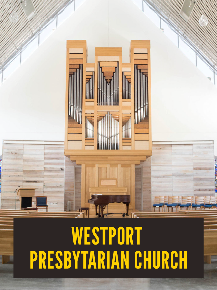 Interior view of Westport Presbyterian Church sanctuary with a large pipe organ, a grand piano, and seating area.  Westport East.