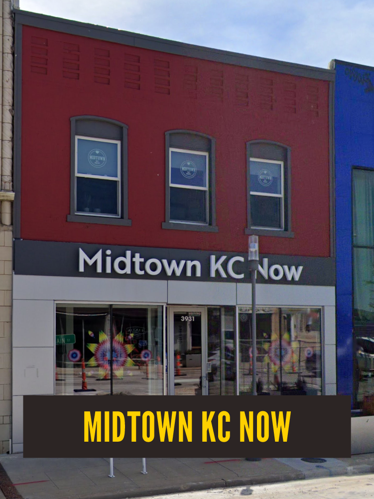 Exterior of a storefront with a sign that reads 'Midtown KC Now' and colorful artwork visible through the windows.  Westport East. 