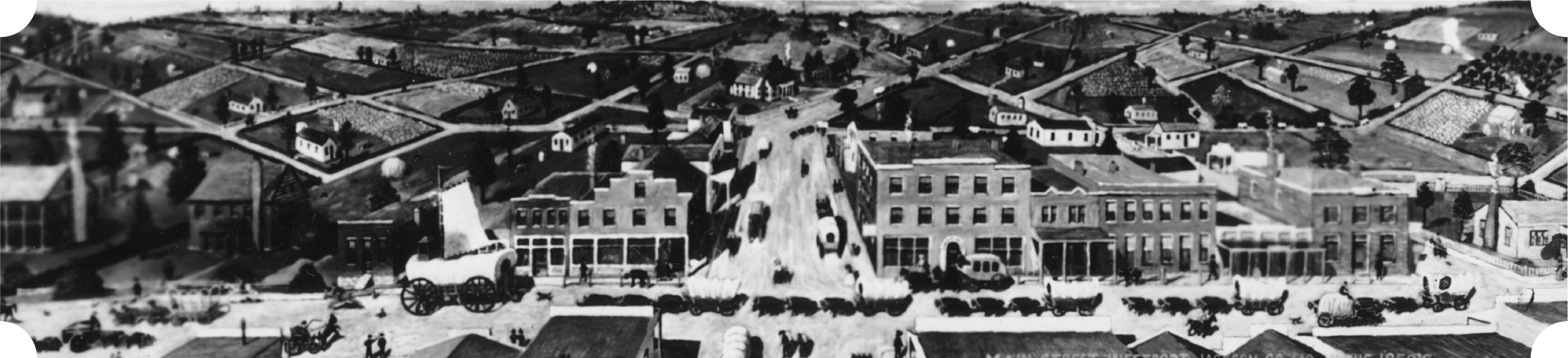Old Westport. A black-and-white aerial view of a vintage small town with early automobiles and horse-drawn carriages on the main street, surrounded by residential houses and farmland.