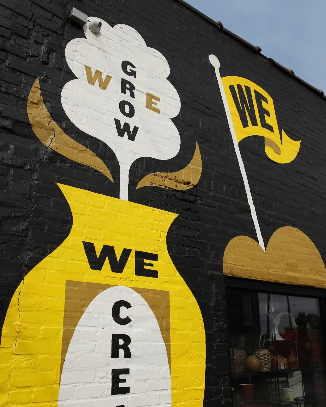Details from our new mural showing various badges and icons that speak to how diverse and joyfully eclectic WE at Westport East are. WE Create, WE shop, WE Connect, WE are Westport East. #westporteast #kansascity #kc