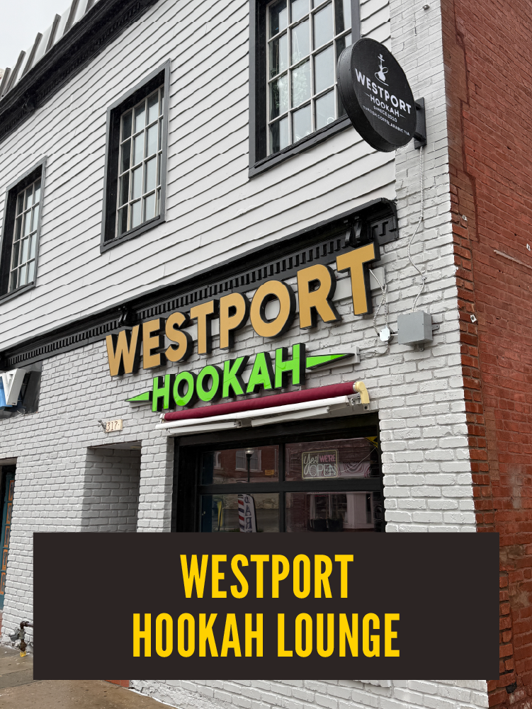 Exterior of Westport Hookah Lounge with a neon sign displaying the name in yellow and green letters, above the entrance door.  Westport East.