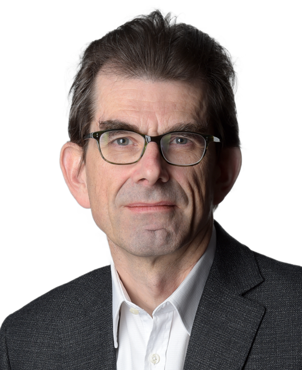 Headshot of a middle-aged man with dark hair, glasses, wearing a white shirt and dark blazer, against a white background.