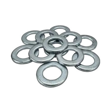 A pile of metallic washers scattered on a surface.