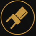 Close-up of a soldering iron with a yellow handle inside a circular black and yellow emblem.