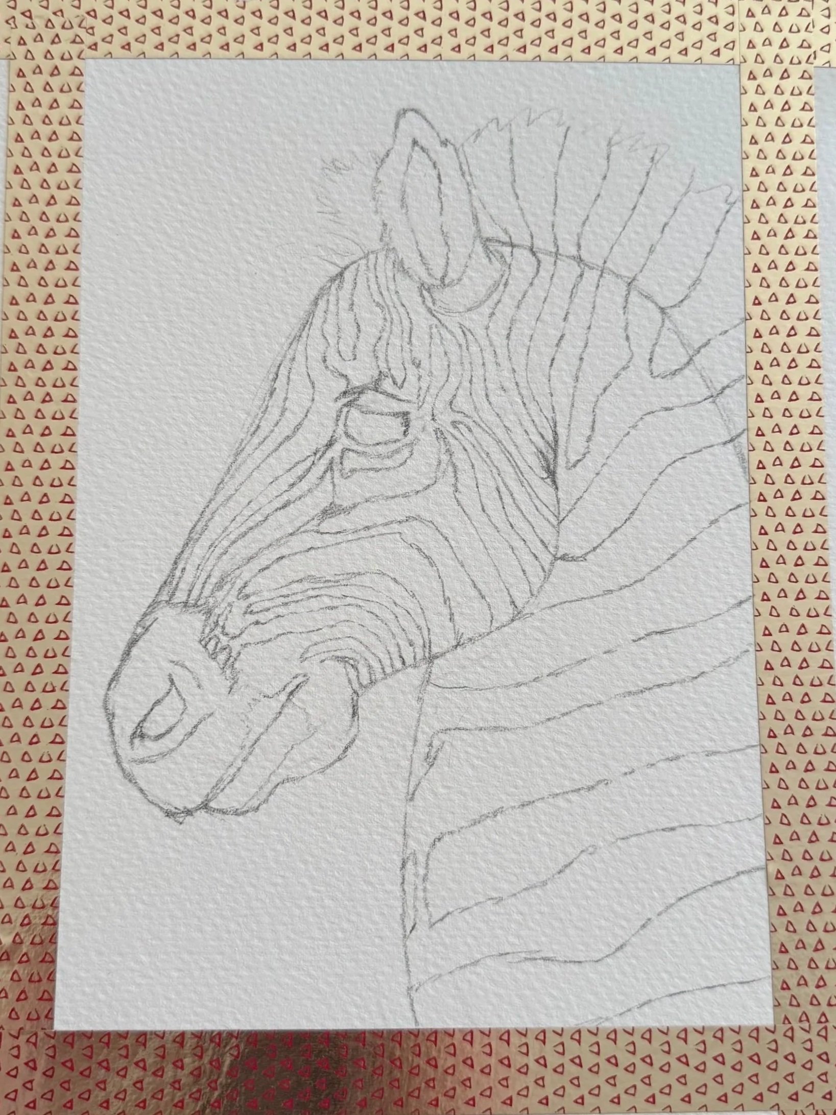 A pencil sketch of a horse's head and neck on textured paper, taped with patterned decorative tape.