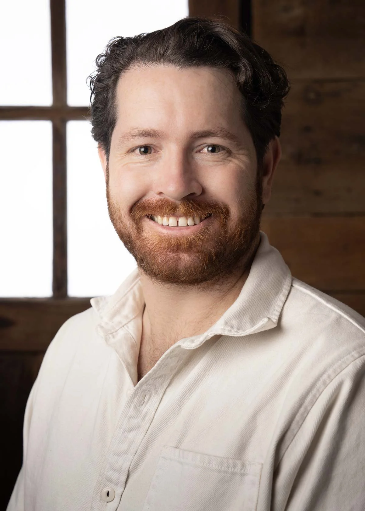 Director of sales Tobias Glidden smiling at camera