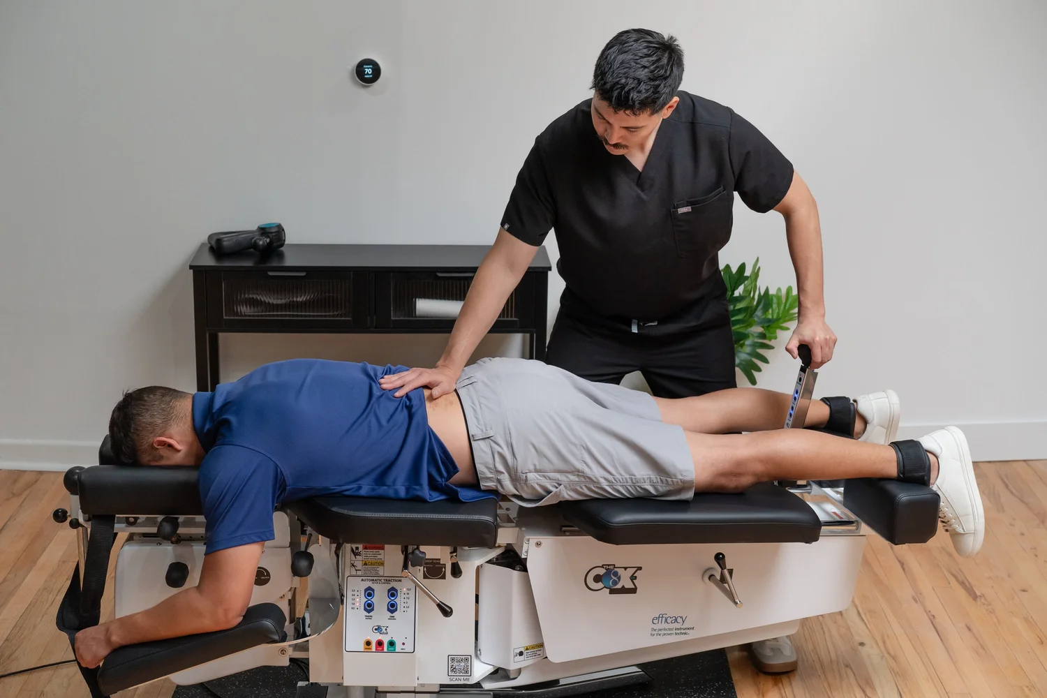 Cox flexion-distraction treatment on the Cox table at NERV Chiropractic in Los Angeles