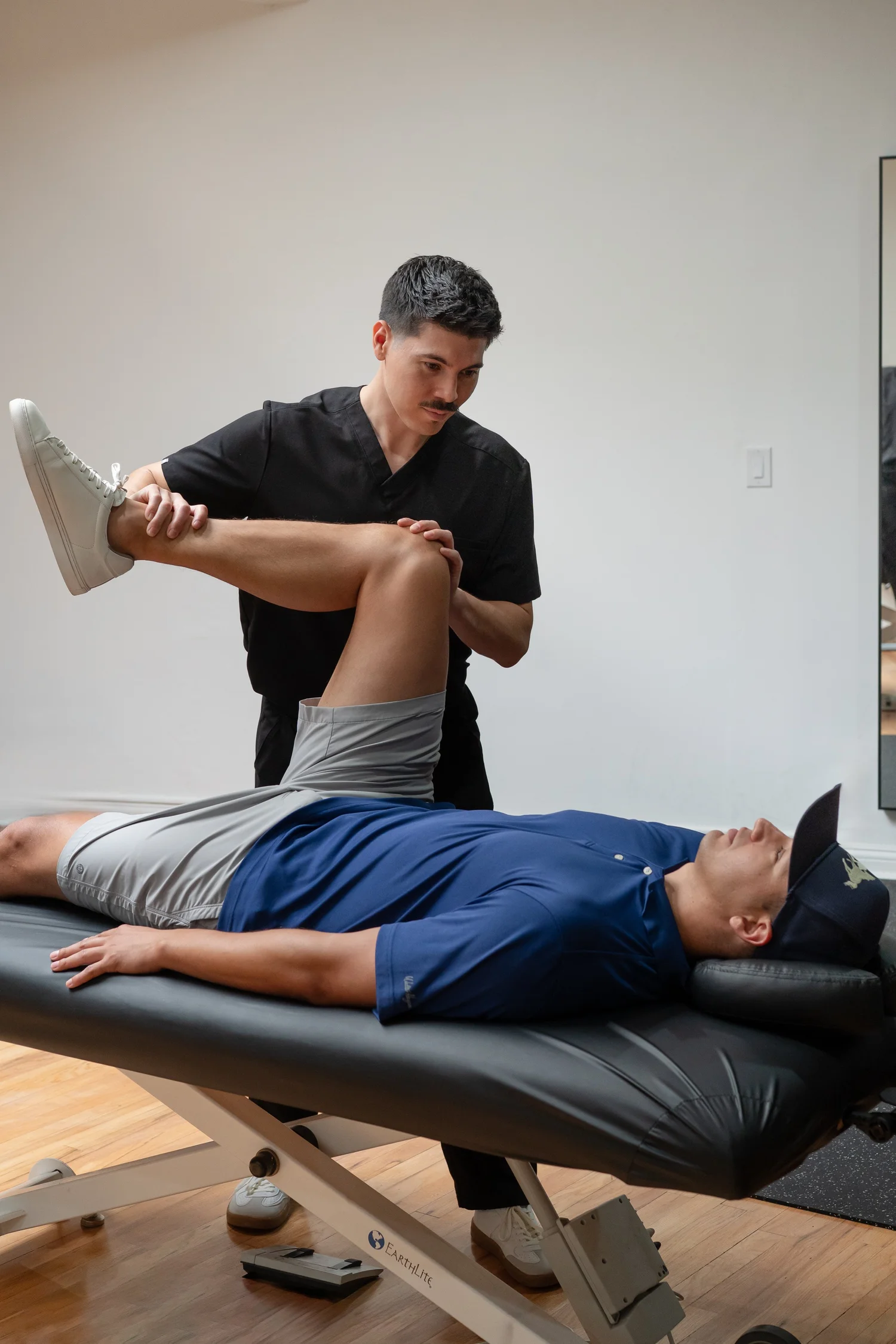 Orthopedic hip assessment during a chiropractic exam at NERV Chiropractic in Los Angeles