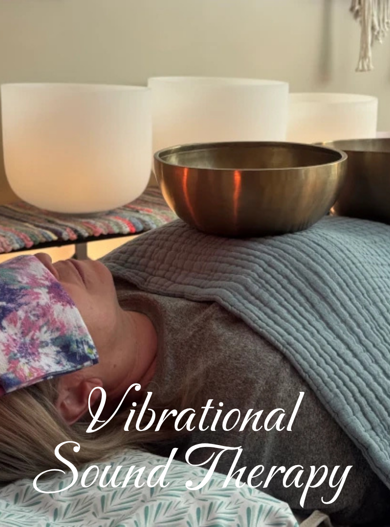 A person lying down with a colorful eye mask, surrounded by singing bowls and a blanket, with the text "Vibrational Sound Therapy" overlayed.