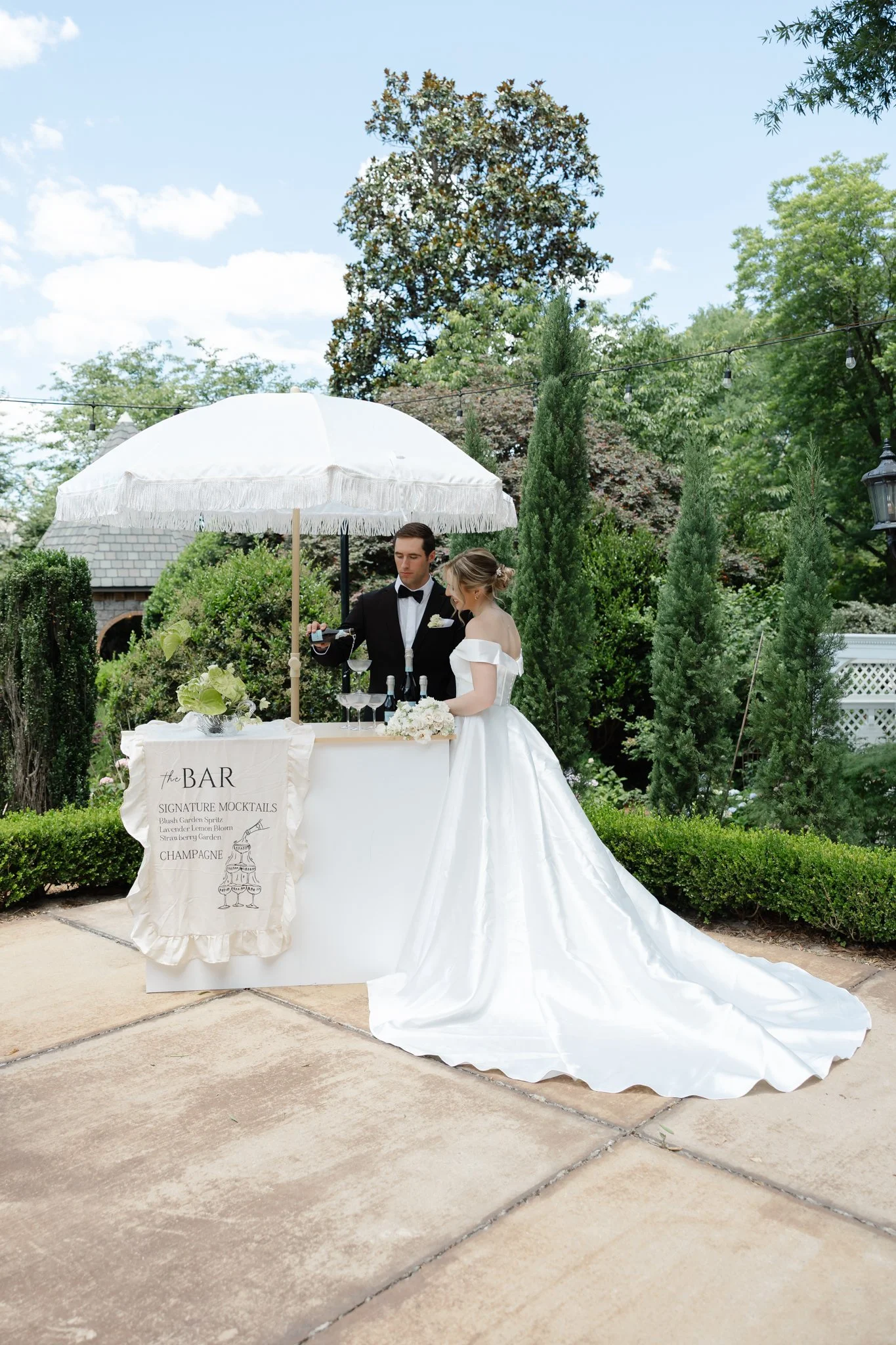 Petals & Pour luxury mobile champagne cart displayed at a Raleigh wedding venue.