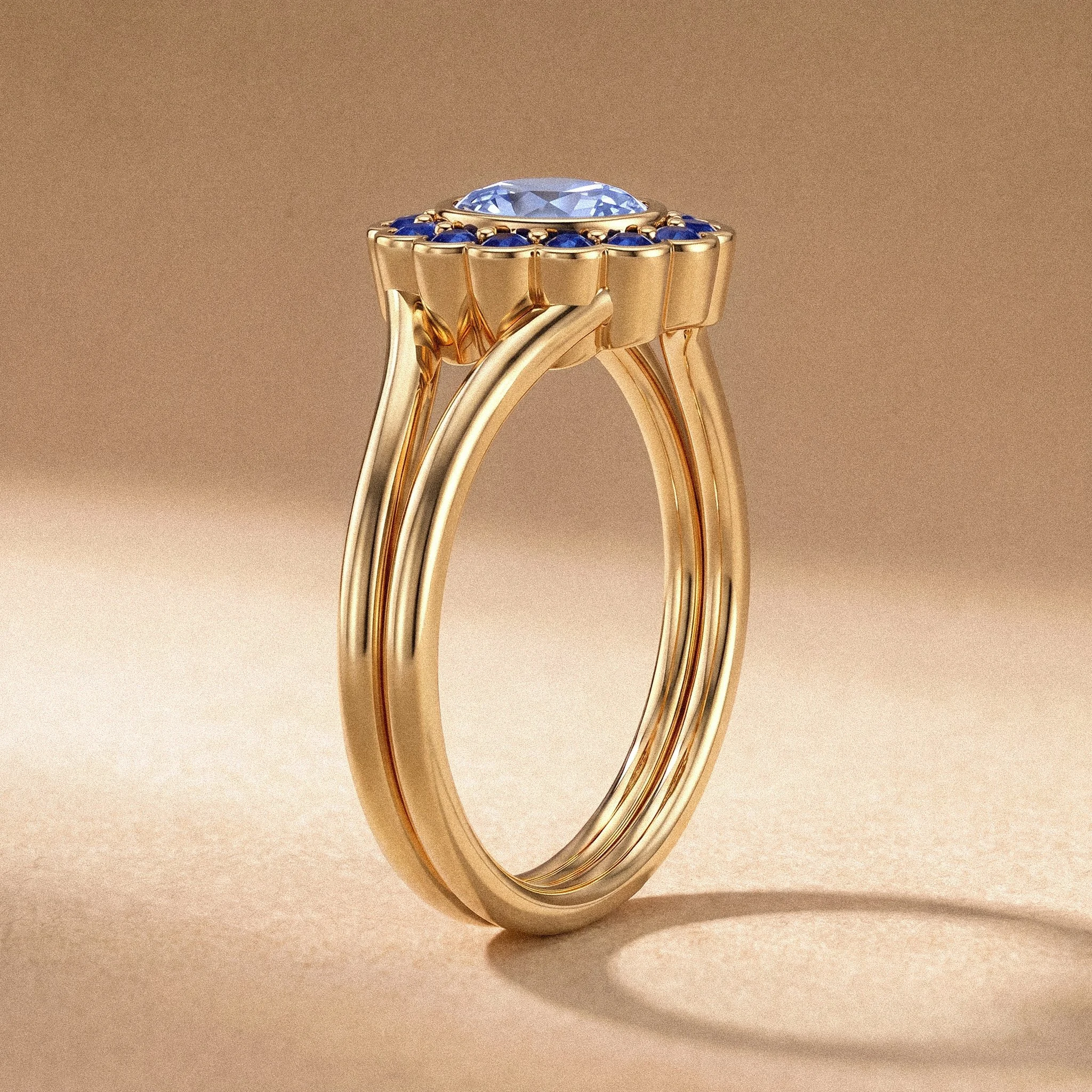 Close-up image of a gold ring with a large clear gemstone surrounded by smaller blue gemstones, placed on a beige surface.