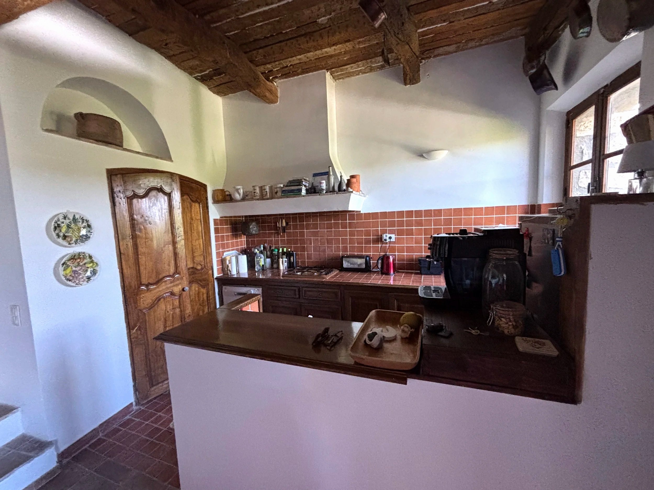 Kitchen with door to larder