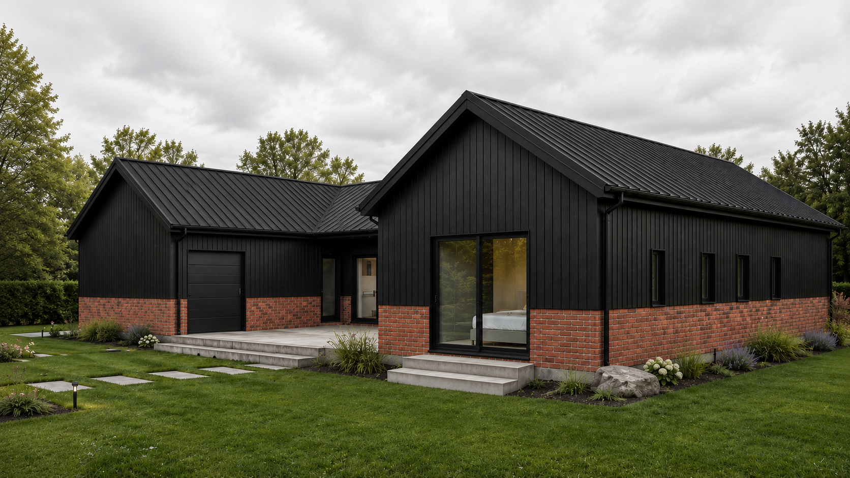 Modern house with black vertical siding and brick accents, sliding glass doors, small front steps, surrounded by a green lawn and small garden beds, under an overcast sky.