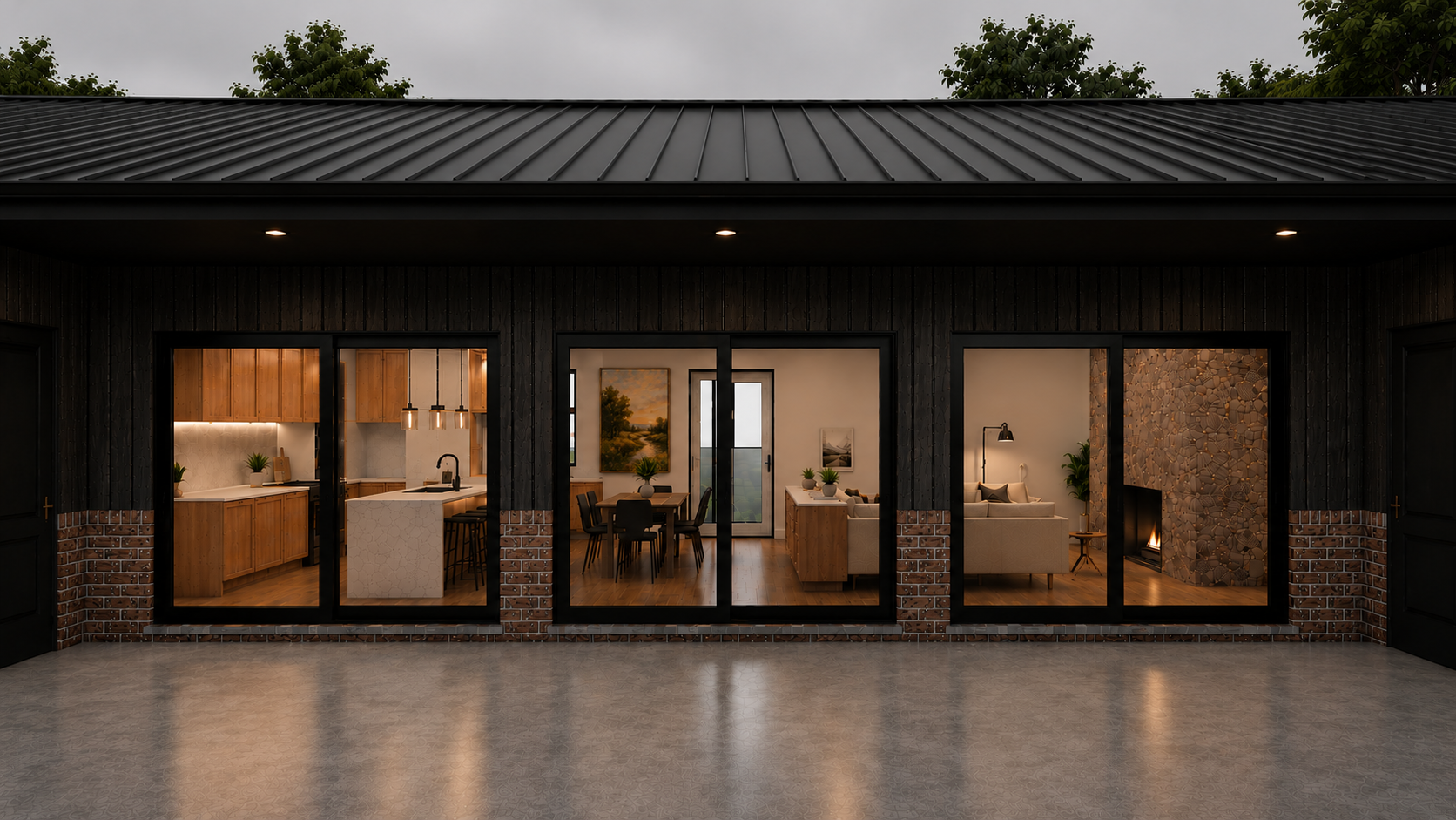 View of a modern house with large glass windows showing an interior with a kitchen, dining area, and living room. The exterior has a dark metal roof, brick accents, and a spacious concrete patio.