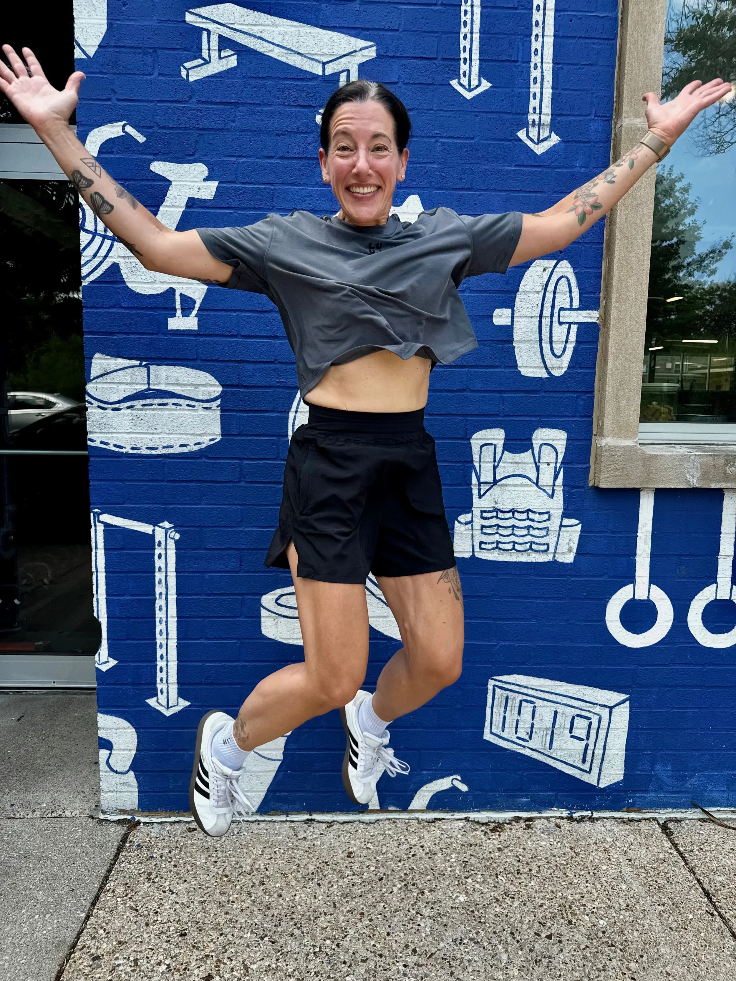 Female CrossFit coach smiling at the camera at Feast CrossFit in Ravenswood, Chicago