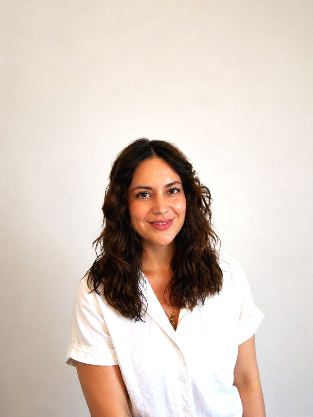 Mayte Alquicira founder of The Simmer Project smiling against neutral background
