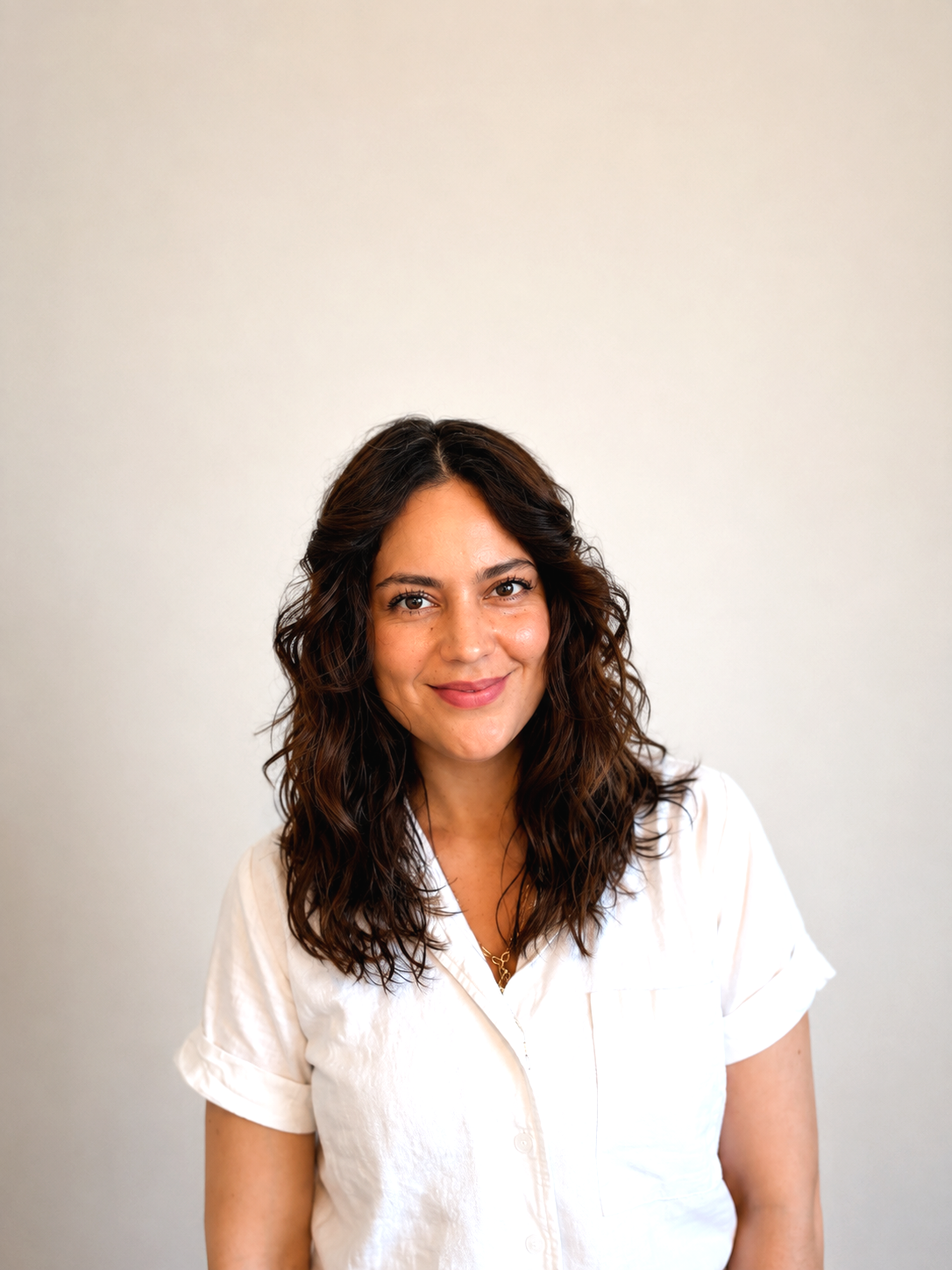 Mayte Alquicira founder of The Simmer Project smiling against neutral background