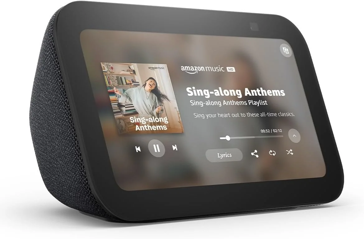 A smart speaker displaying a music playlist titled "Sing-along Anthems" by Amazon Music, with the song "Sing-along Anthems" playing.