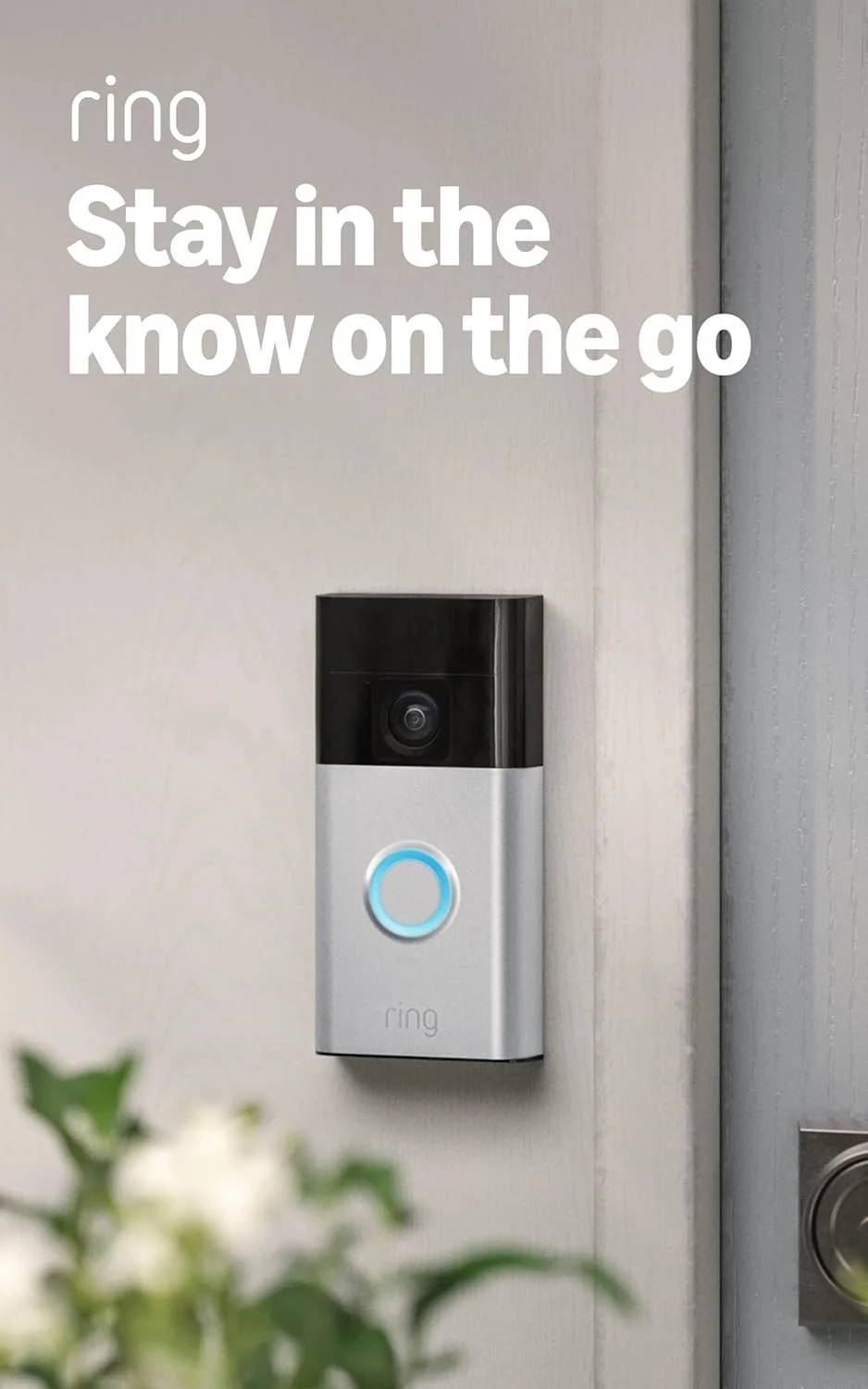 A doorbell with a camera and a glowing blue ring, mounted on a wall next to a door frame. Text overlay says 'ring, stay in the know on the go.'