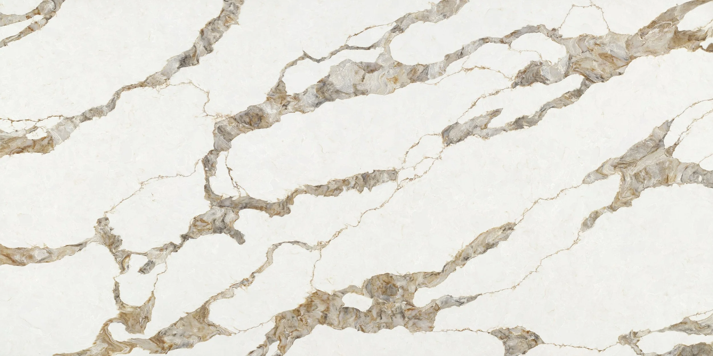 Close-up view of white marble with gray and gold veining patterns.
